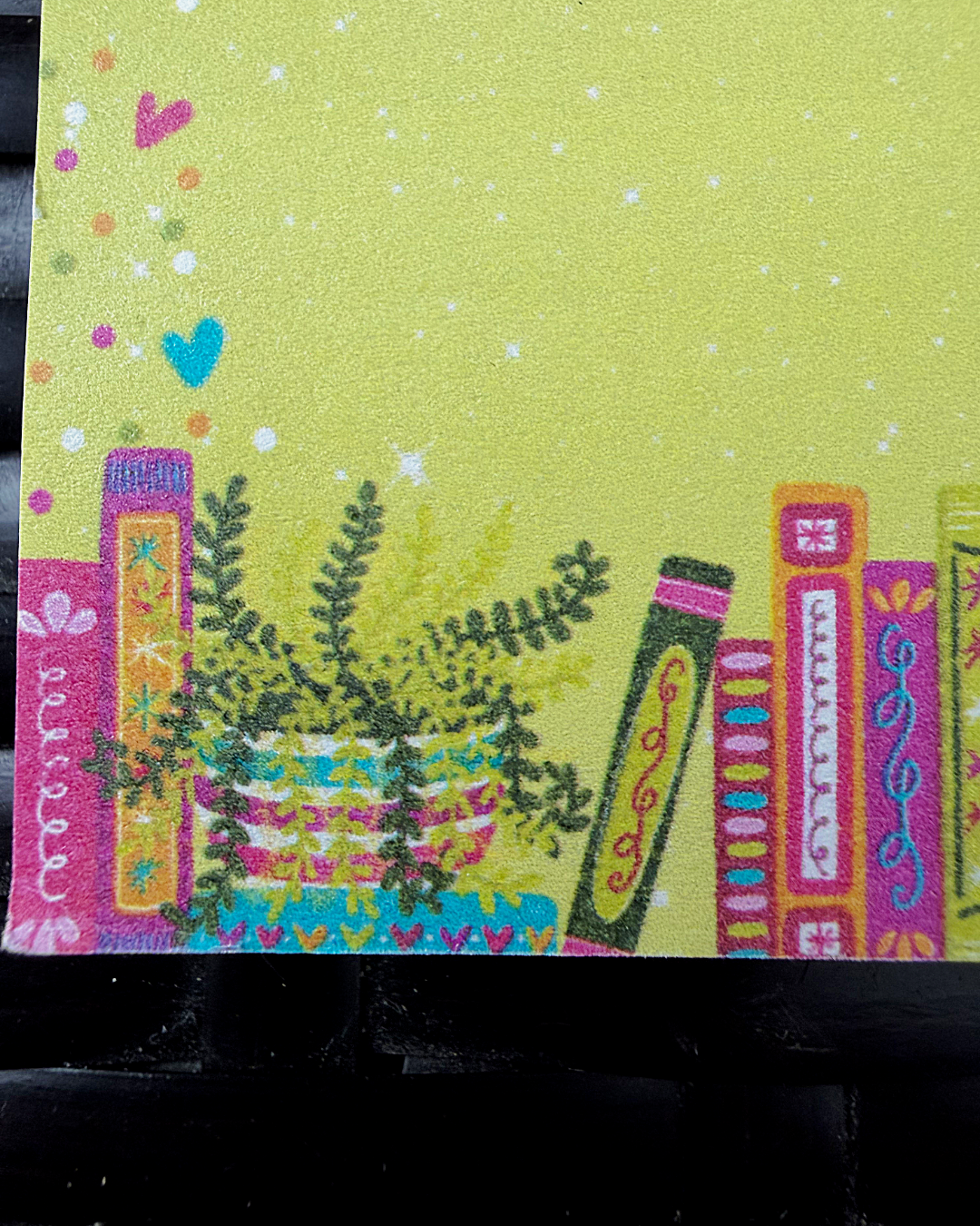 Decorative card with plants and colorful borders on a green background
