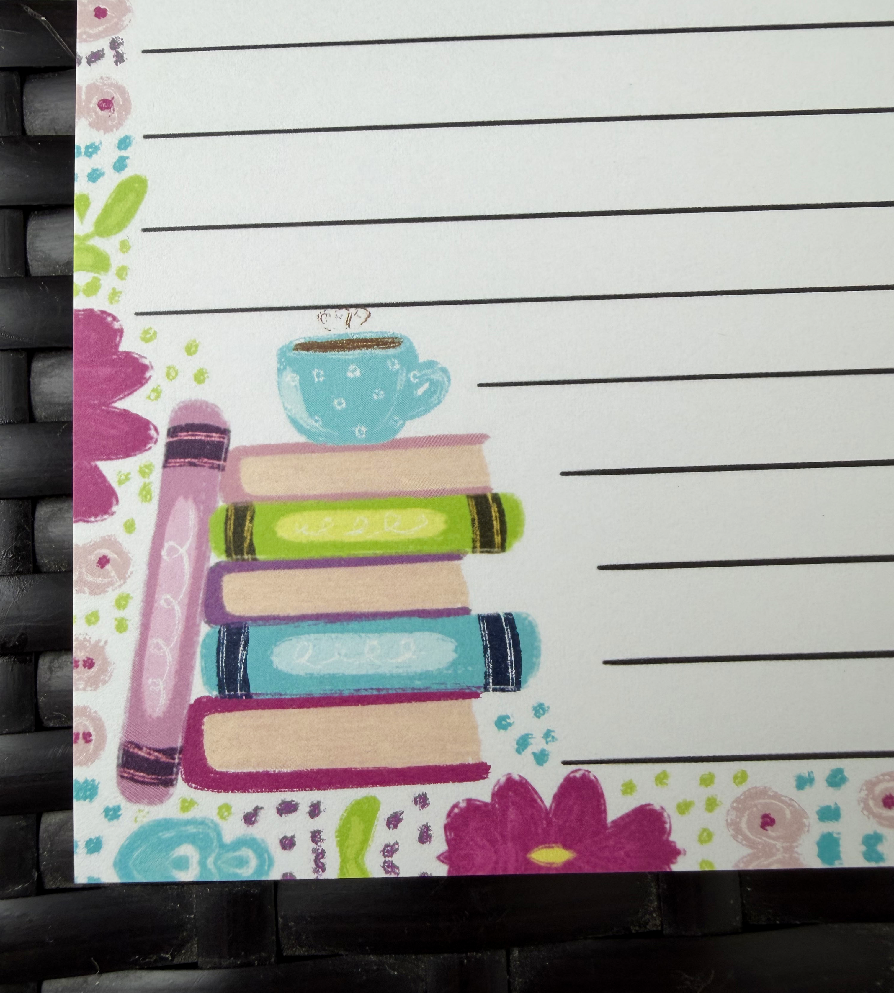 "4.25x5.5 inch 50-sheet notepad by Emily Cromwell Designs featuring a colorful book stack, a teacup, and a vibrant floral border."