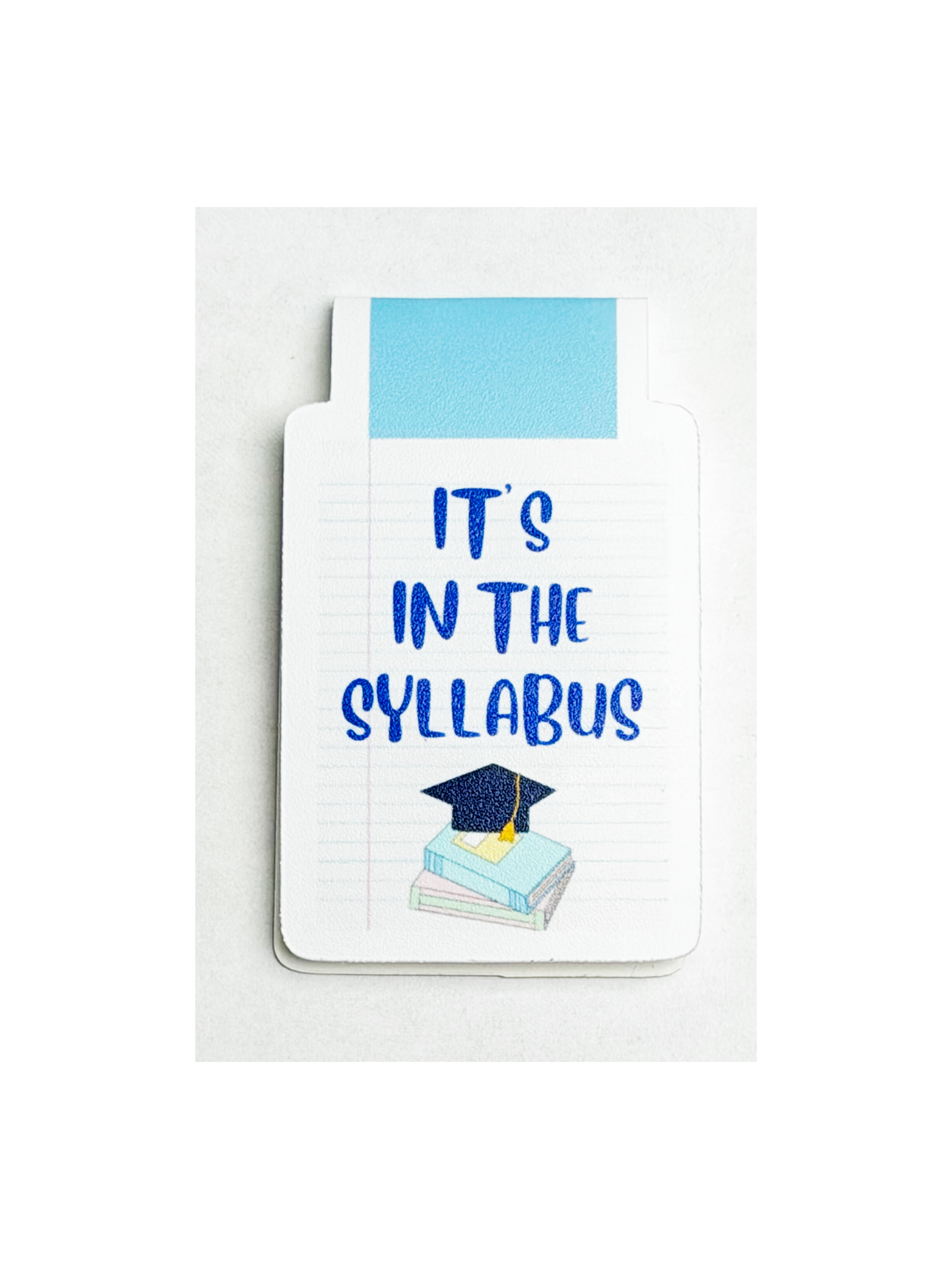 Note card with 'It's in the Syllabus' text and graduation cap and books illustration on a white background