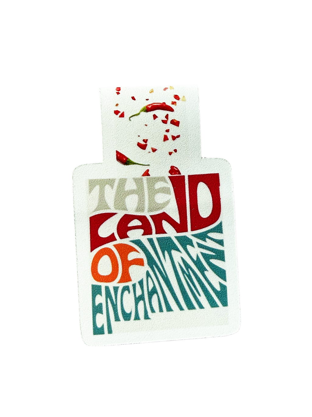 Product packaging with 'The Land of Enchantment' text and chili pepper design on a white background