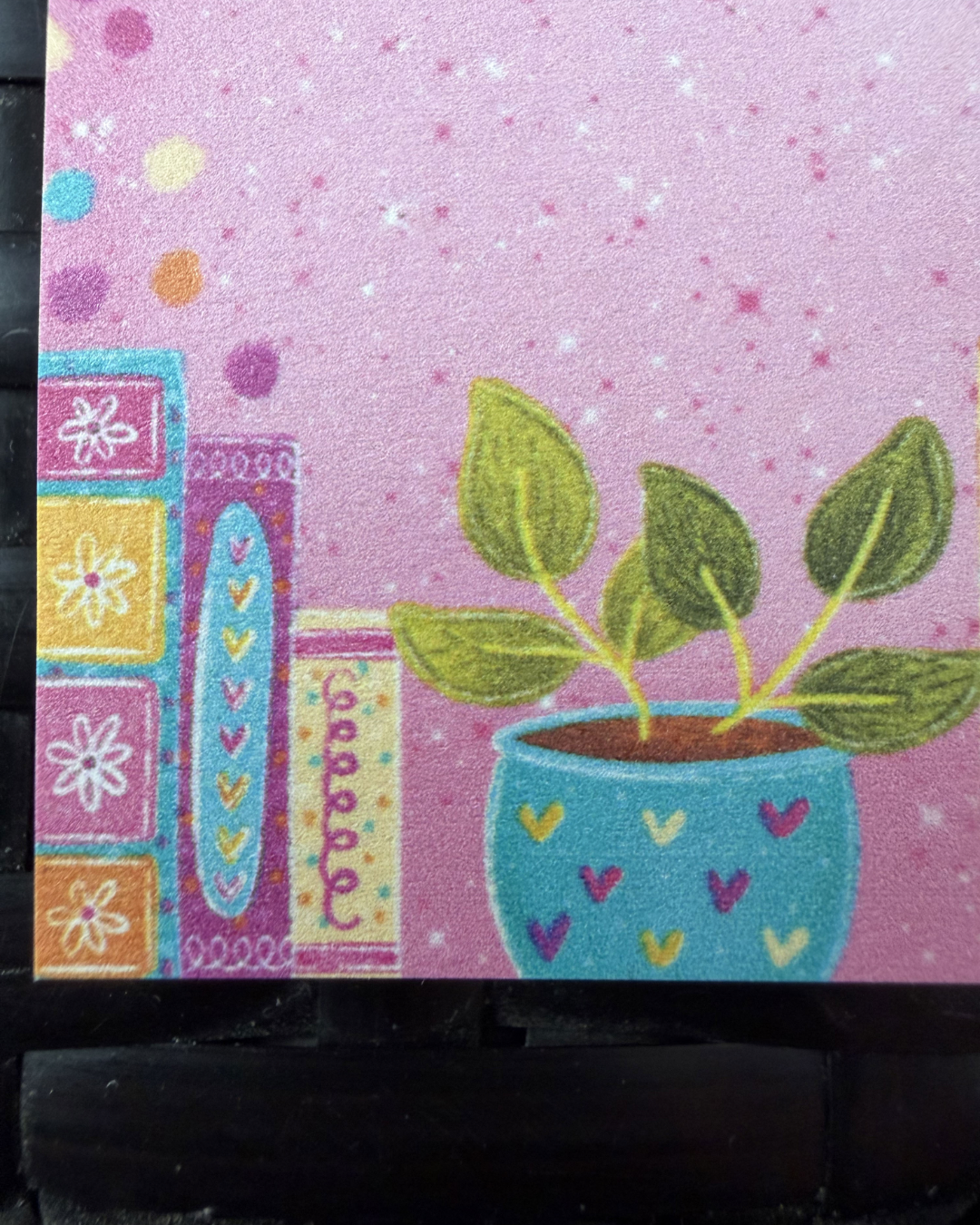 Decorative mat with a potted plant design on a pink background