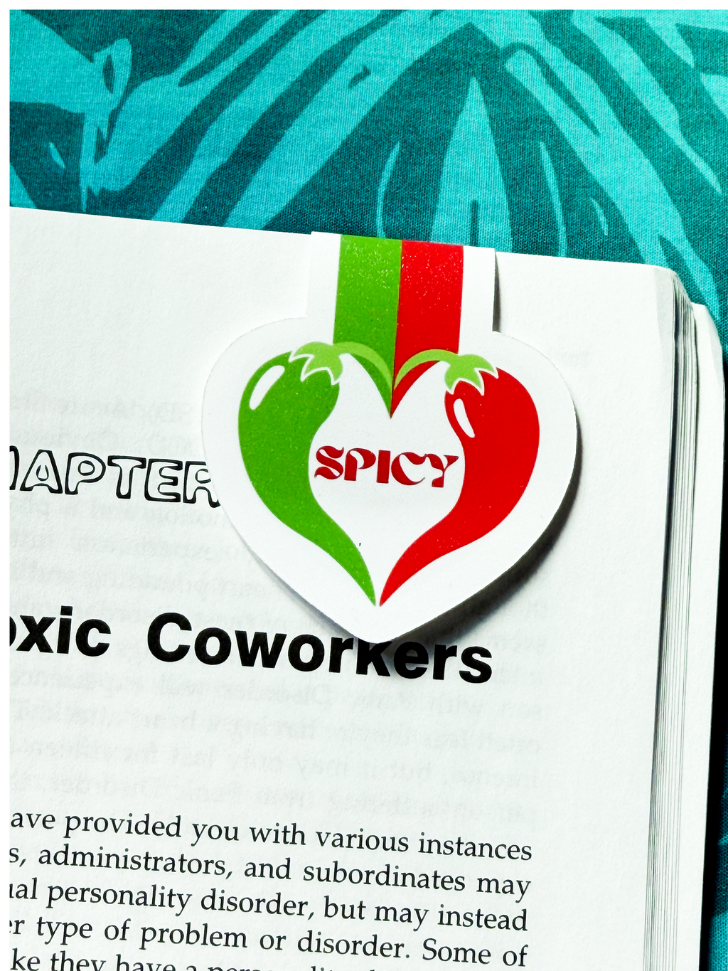 Magazine with a 'Spicy' logo sticker on a page titled 'Toxic Coworkers'.