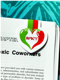 Magazine with a 'Spicy' logo sticker on a page titled 'Toxic Coworkers'.